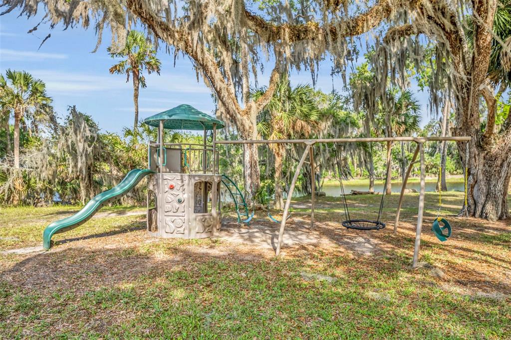 430 Cypress Isles Road Osteen, FL 32764 - Photo 51 of 55 a view of outdoor space with deck