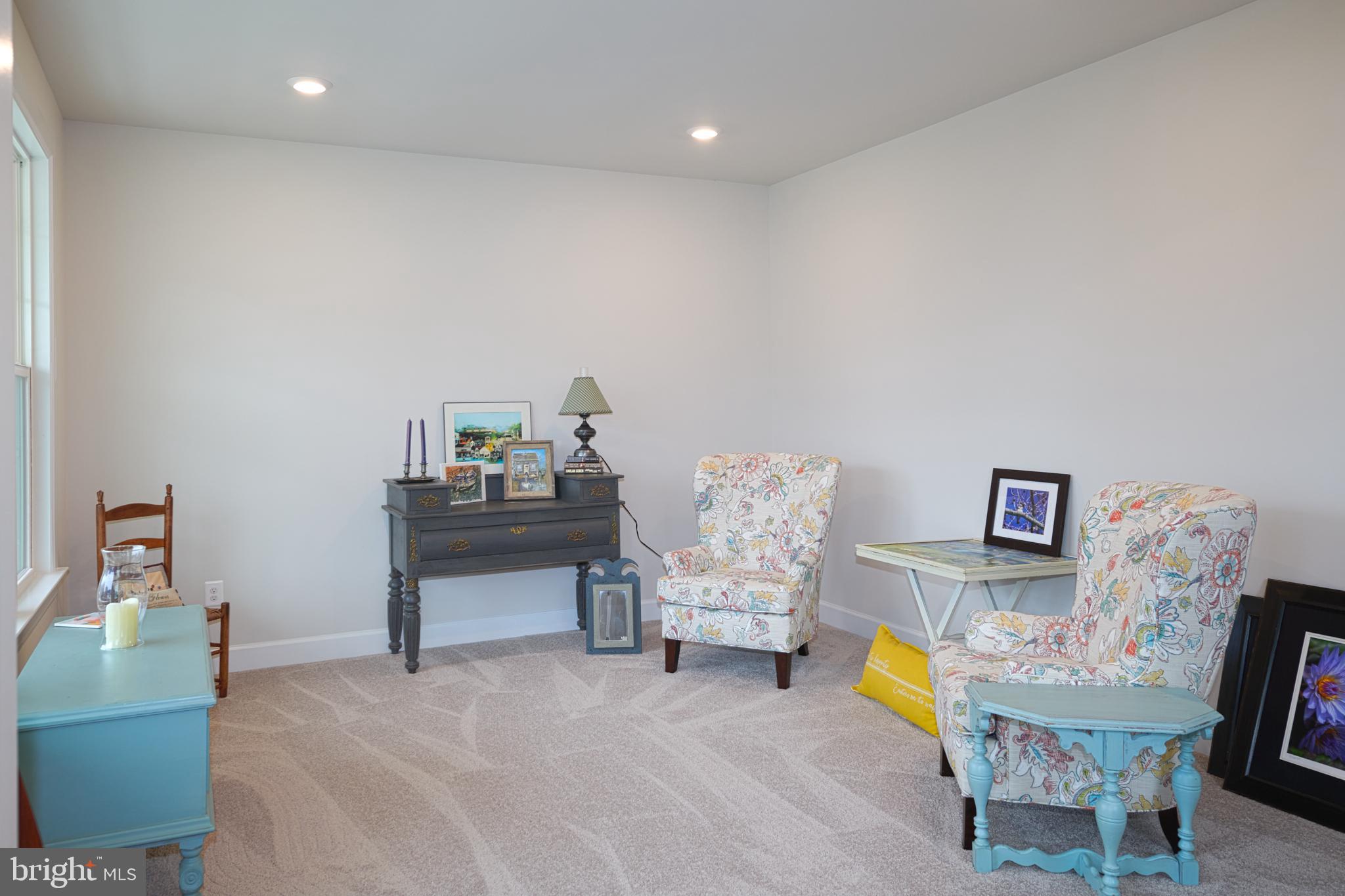 33173 Ponte Vecchio Plaza Ocean View, DE 19970 - Photo 11 of 19 a living room with furniture and a table