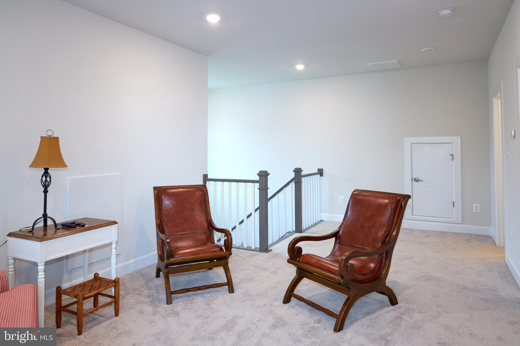 33173 Ponte Vecchio Plaza Ocean View, DE 19970 - Photo 14 of 19 a living room with furniture and a lamp