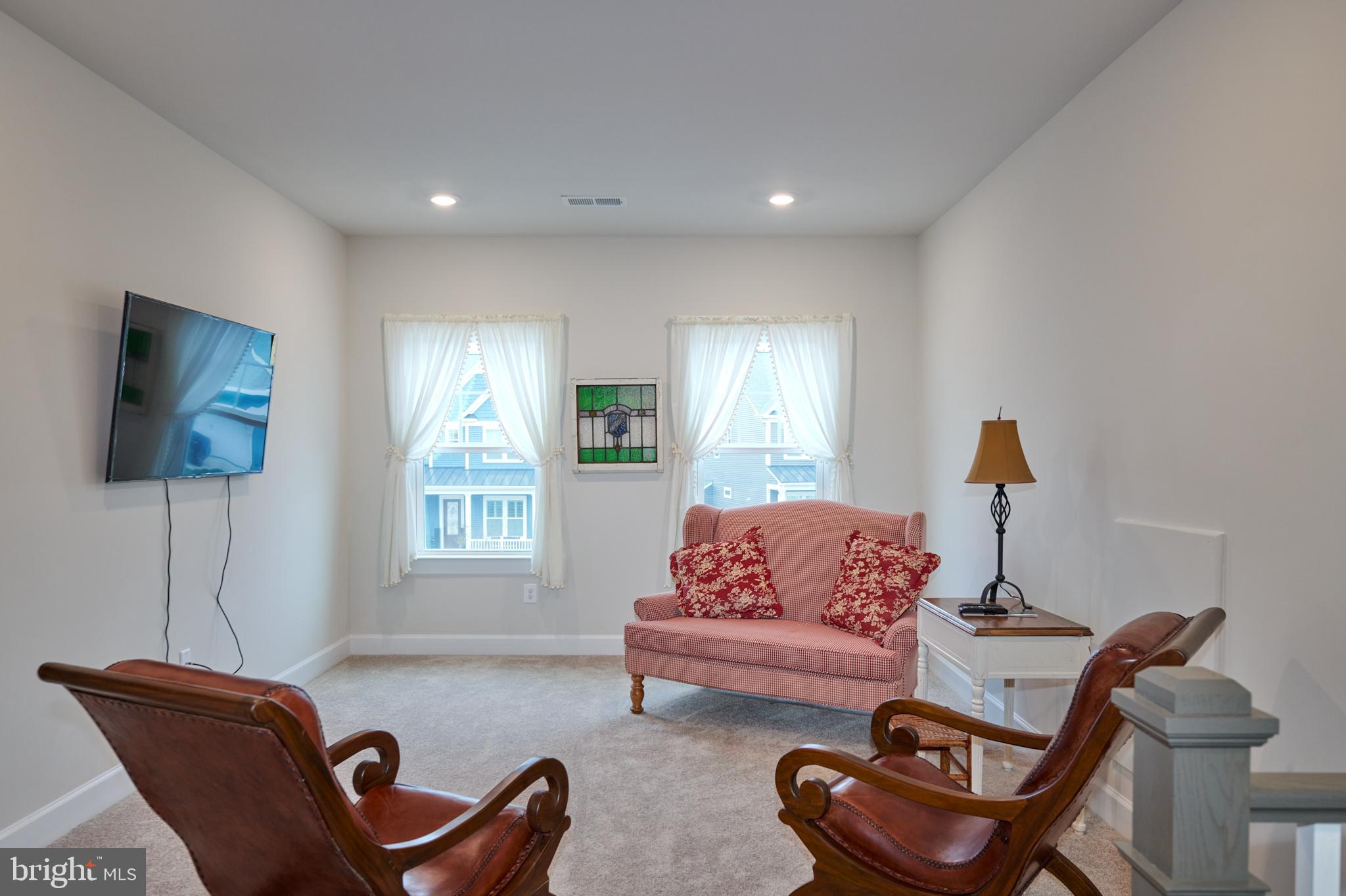 33173 Ponte Vecchio Plaza Ocean View, DE 19970 - Photo 17 of 19 a living room with furniture a rug and a window