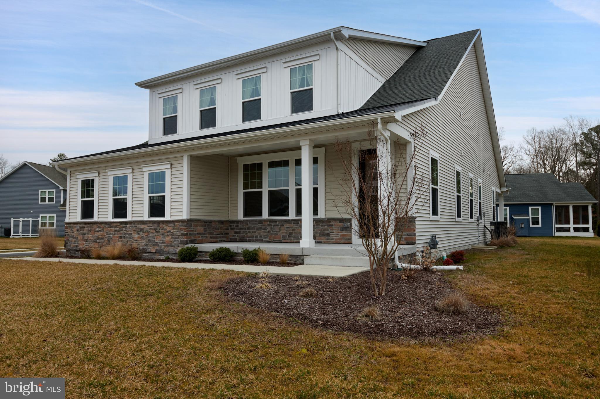 33173 Ponte Vecchio Plaza Ocean View, DE 19970 - Photo 2 of 19 a front view of a house with a yard