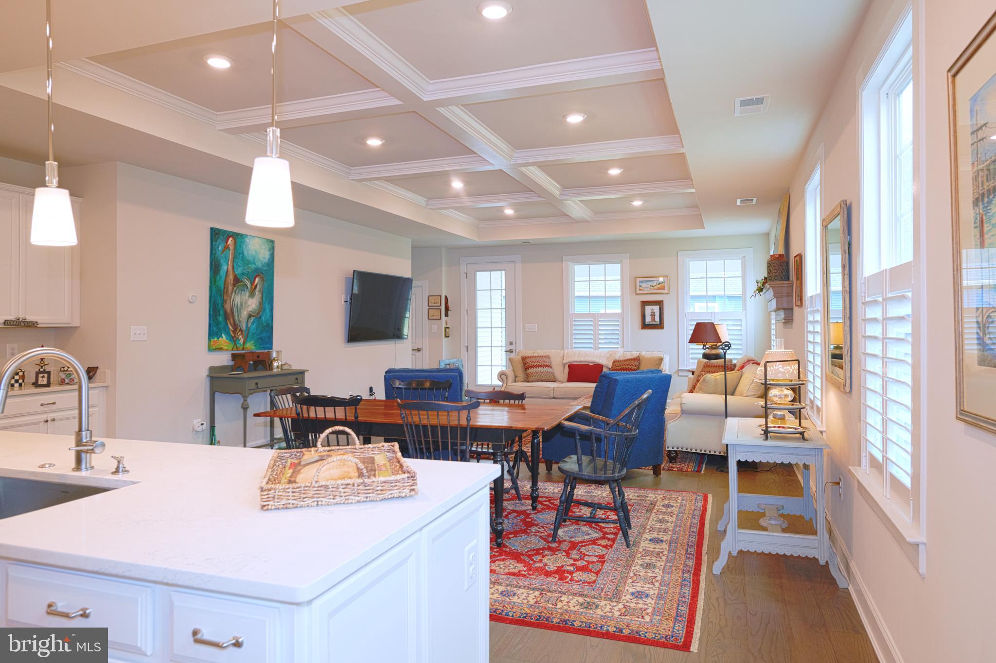 33173 Ponte Vecchio Plaza Ocean View, DE 19970 - Photo 6 of 19 a living room with furniture a large window and flat screen tv