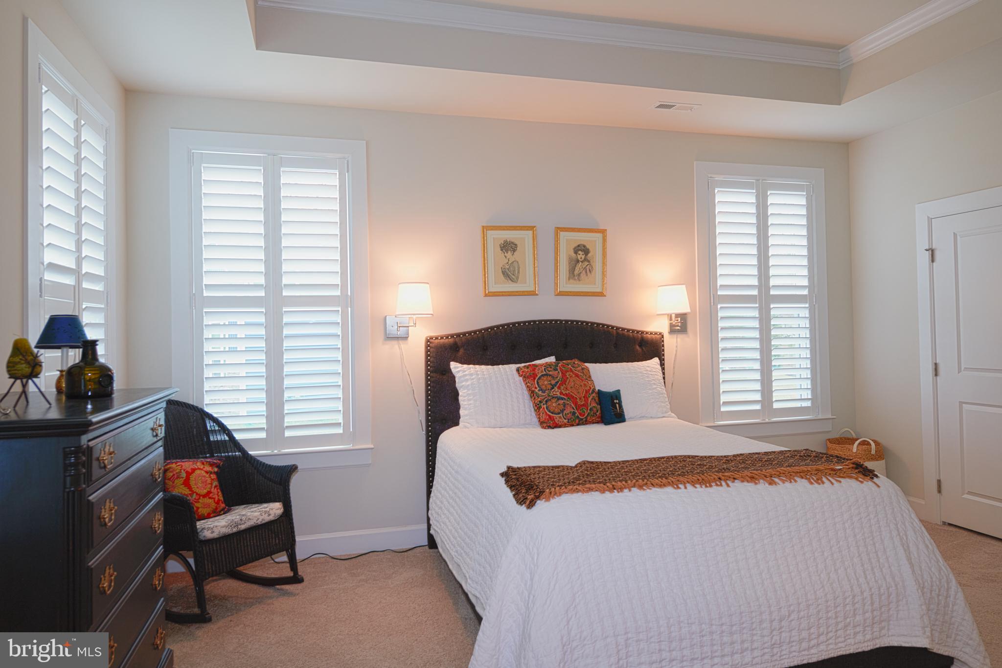 33173 Ponte Vecchio Plaza Ocean View, DE 19970 - Photo 7 of 19 a bedroom with a bed and a window