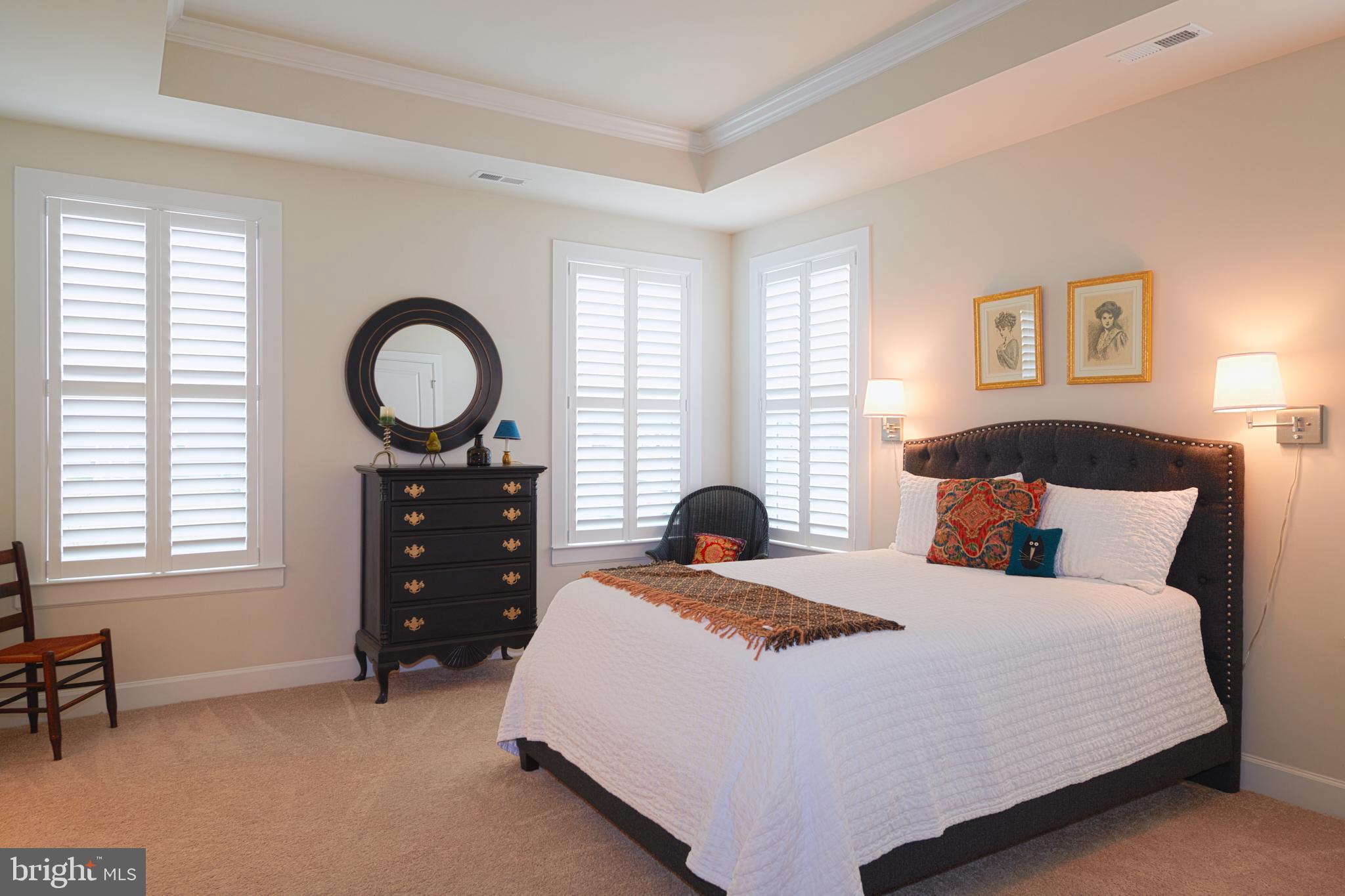 33173 Ponte Vecchio Plaza Ocean View, DE 19970 - Photo 8 of 19 a bedroom with a bed and window