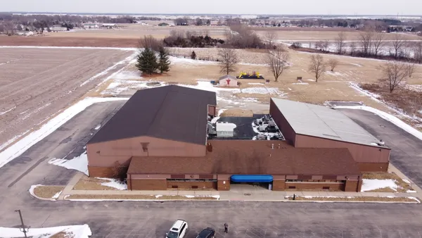 an aerial view of a house with outdoor space