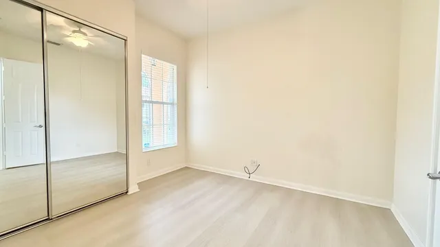 a bathroom with a tub a sink and a window