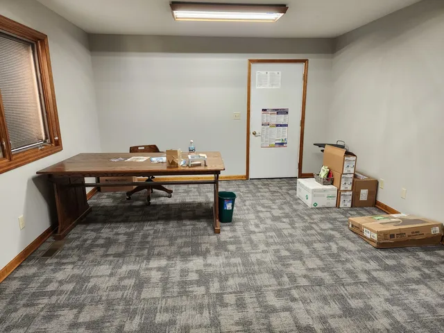 a room with a wooden floor and musical instruments