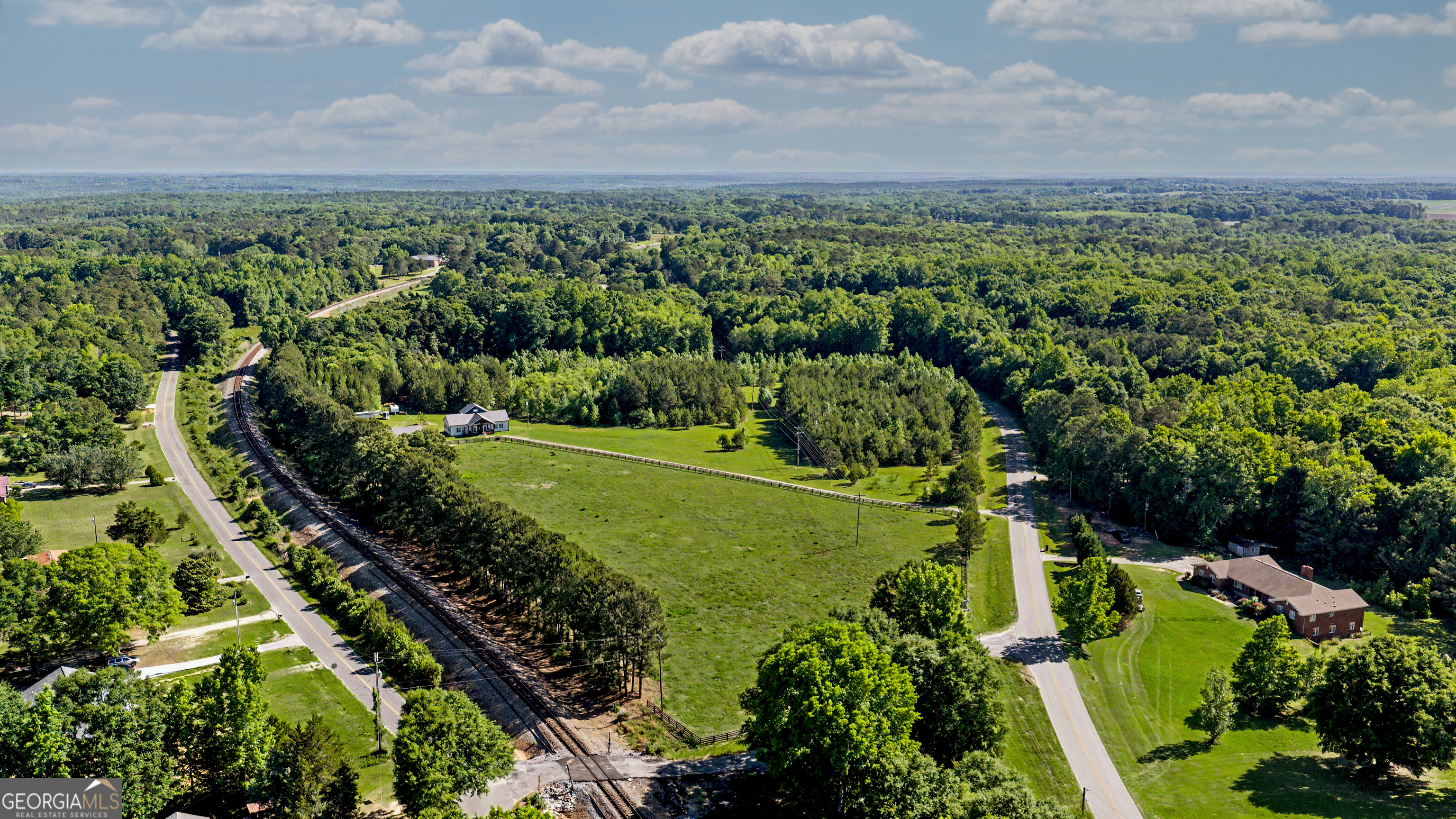 213 Fredonia Church Road Barnesville, GA 30204 - Photo 5 of 32 an aerial view of a golf course with a yard