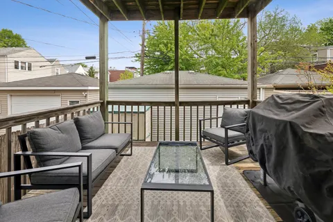 a view of a balcony with furniture