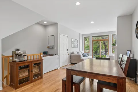 a view of a dining room with furniture window and wooden floor
