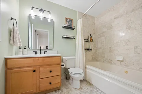 a bathroom with a sink a toilet and a bathtub