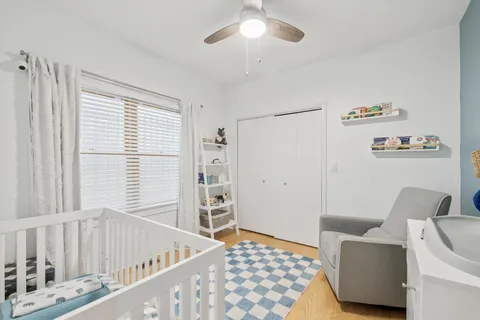 a bedroom with furniture and a window