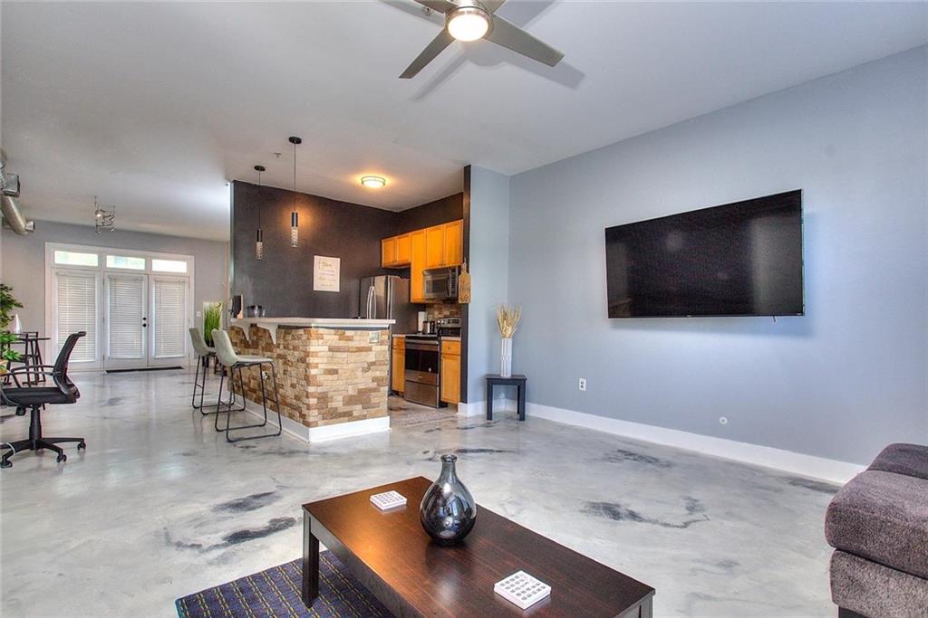 502 Pryor Street Southwest Atlanta, GA 30312 - Photo 14 of 21 a living room with furniture and a flat screen tv
