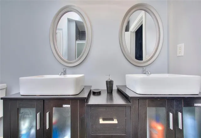 a bedroom with a bed and a dresser in it