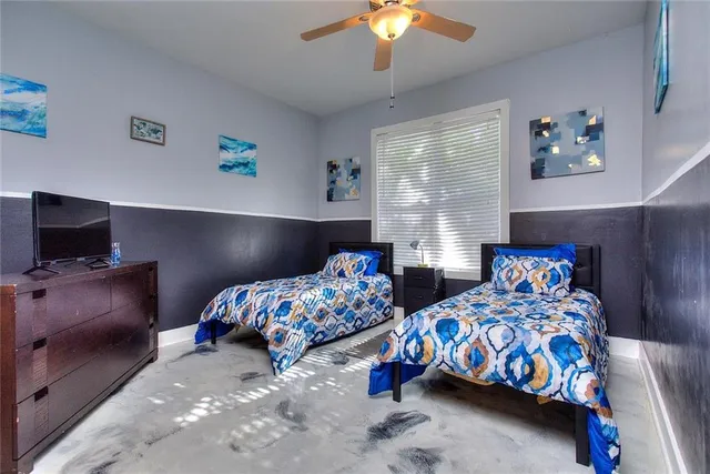 a bathroom with a sink and mirror with toilet