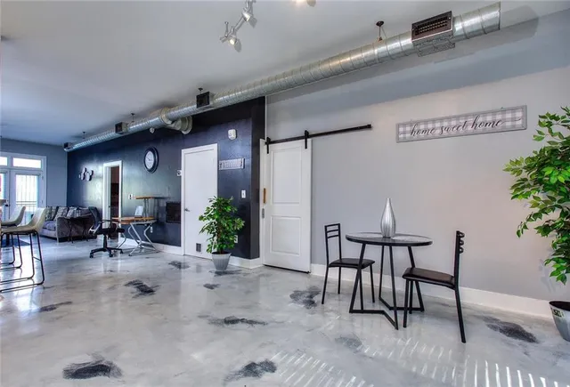 an entryway and livingroom with furniture