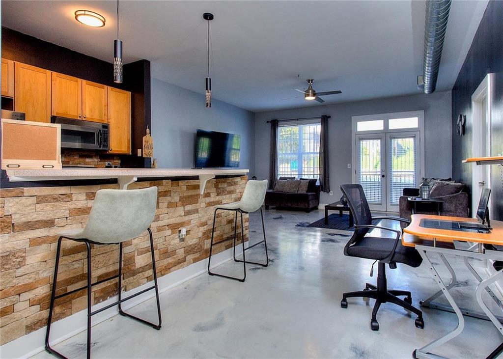 502 Pryor Street Southwest Atlanta, GA 30312 - Photo 9 of 21 a living room with furniture kitchen view and a large window
