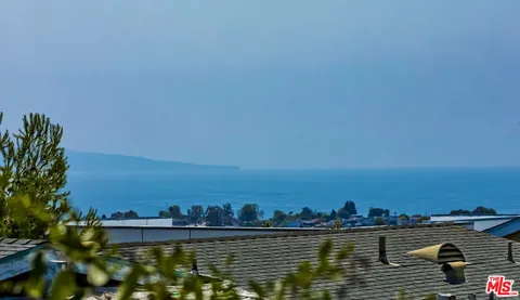 a view of ocean view and city view