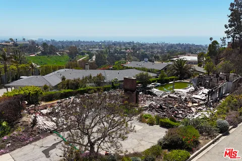 a bedroom with a bed and a white comforter
