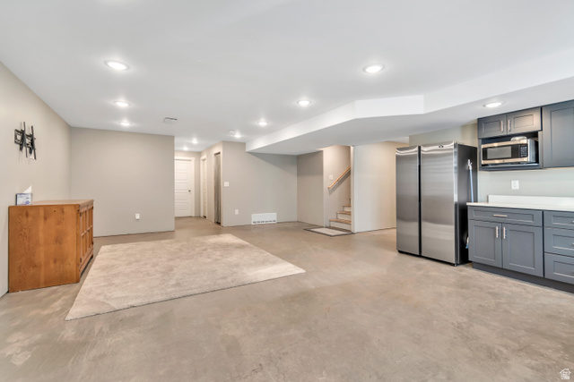 3232 West 1670th Street North Provo, UT 84601 - Photo 29 of 33 Finished basement featuring freestanding refrigerator and recessed lighting