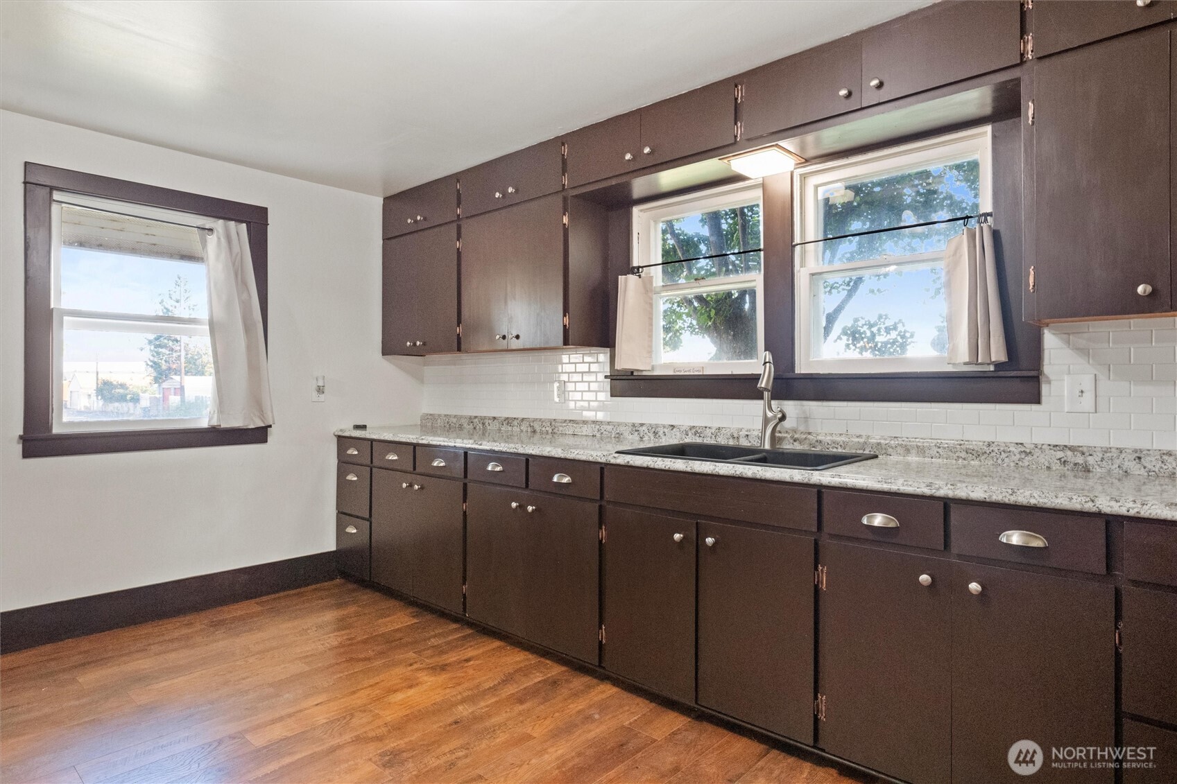 505 D Street Southwest Ephrata, WA 98823 - Photo 12 of 28 a kitchen with granite countertop a sink window and cabinets