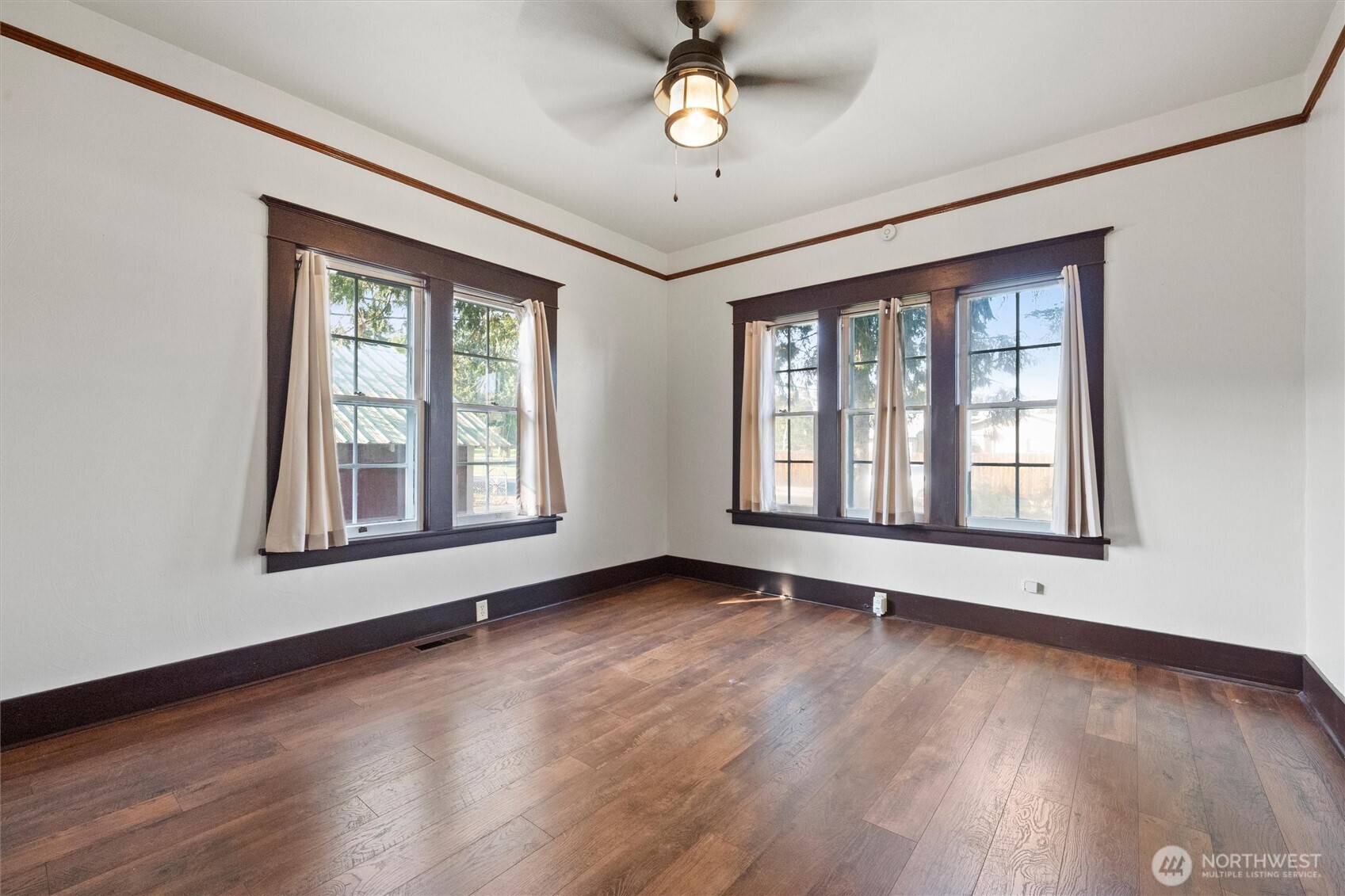 505 D Street Southwest Ephrata, WA 98823 - Photo 15 of 28 a view of an empty room with wooden floor and a window