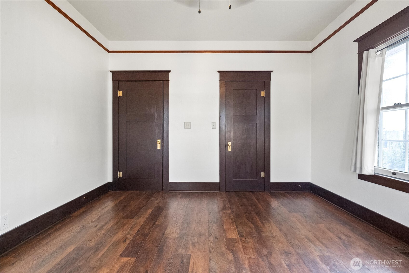 505 D Street Southwest Ephrata, WA 98823 - Photo 16 of 28 a view of an empty room with wooden floor and a window