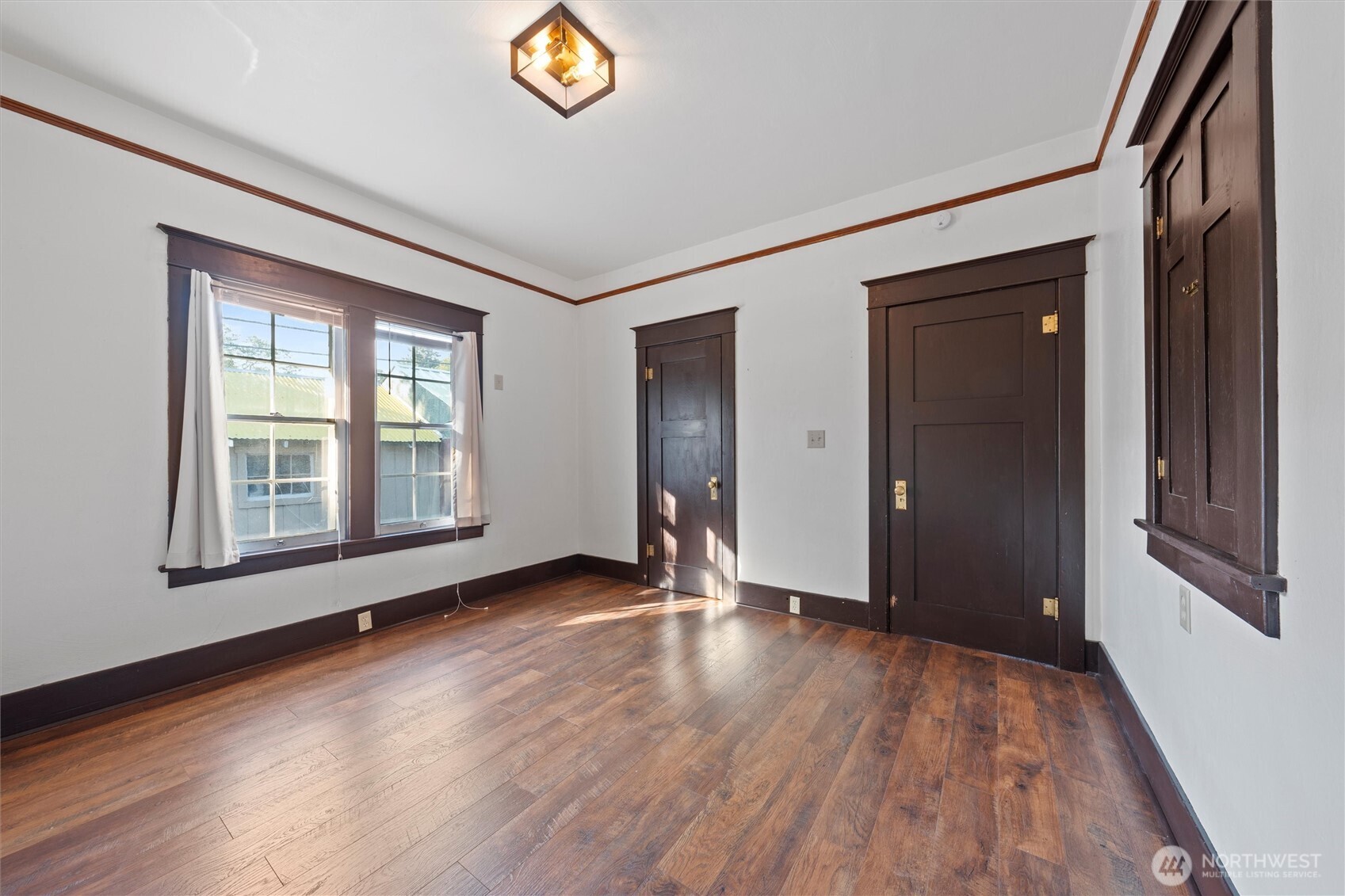 505 D Street Southwest Ephrata, WA 98823 - Photo 20 of 28 a view of an empty room with wooden floor and a window