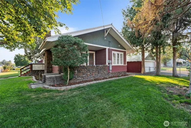 front view of a house with a yard