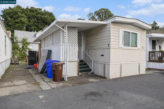 a view of a house with a garage and chair