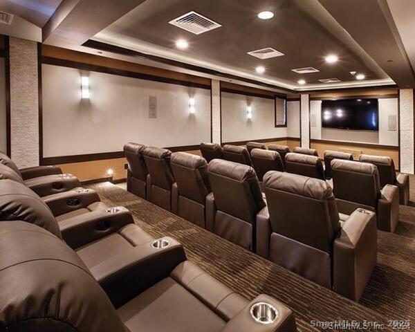 12 Putnam Lane Danbury, CT 06810 - Photo 30 of 33 a media room with lots of chairs and a projector screen