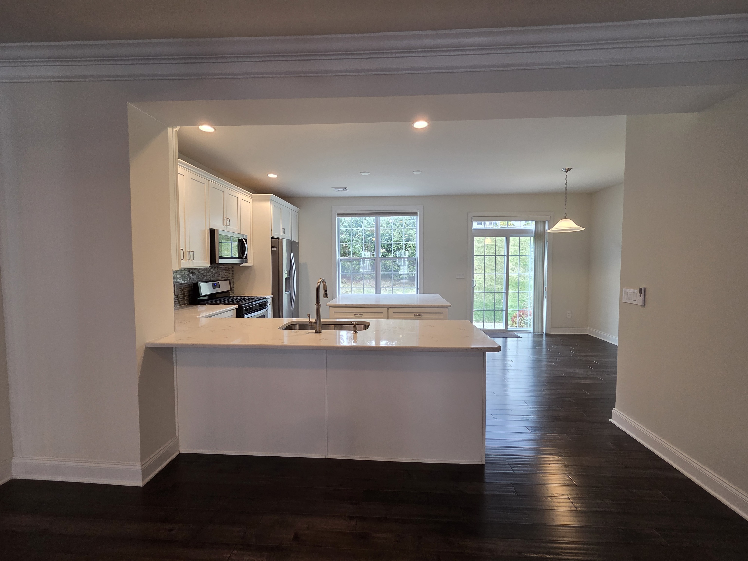 12 Putnam Lane Danbury, CT 06810 - Photo 3 of 33 a view of kitchen with sink and wooden floor