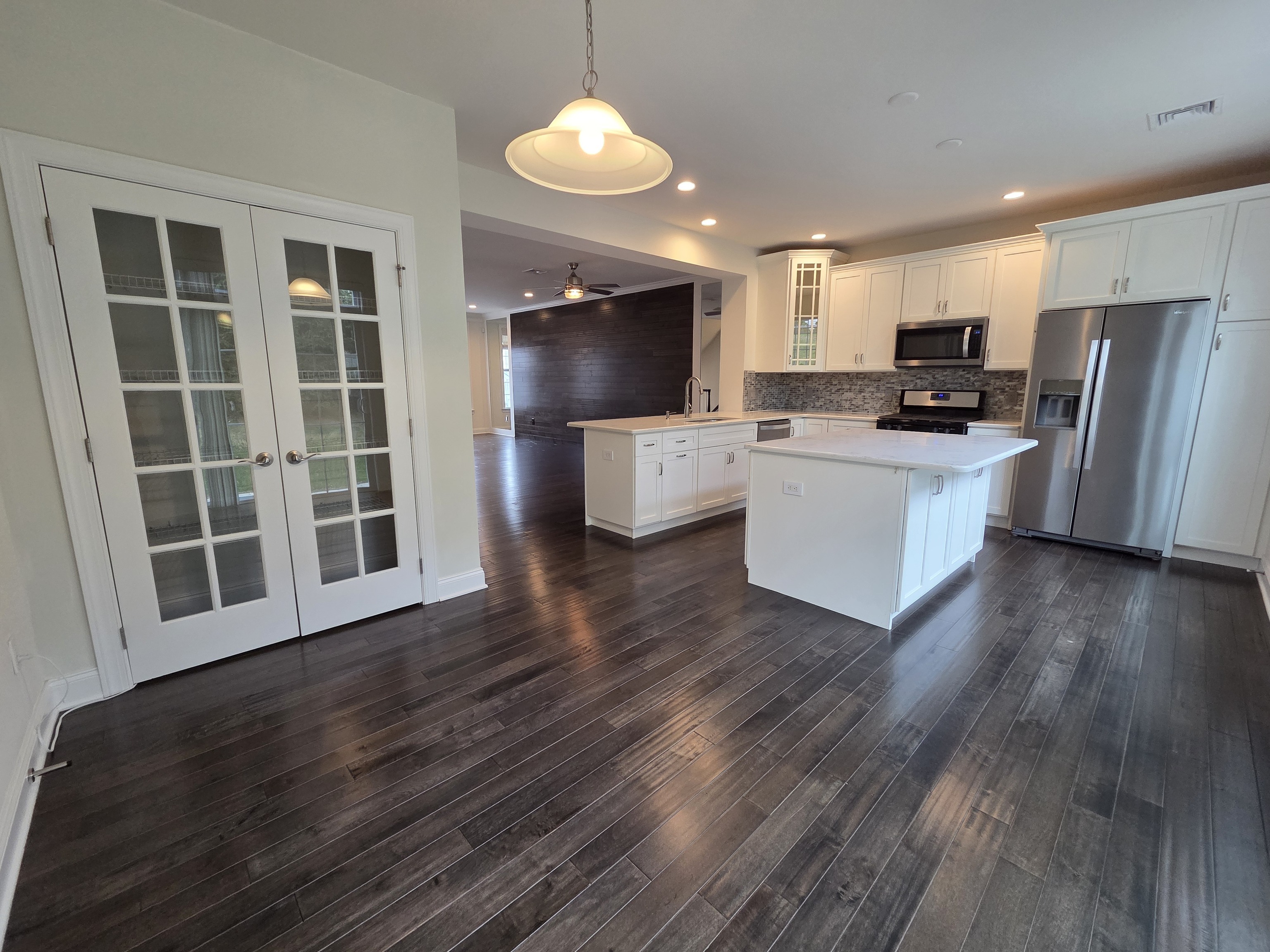 12 Putnam Lane Danbury, CT 06810 - Photo 7 of 33 a view of kitchen with stainless steel appliances wooden floor and large window