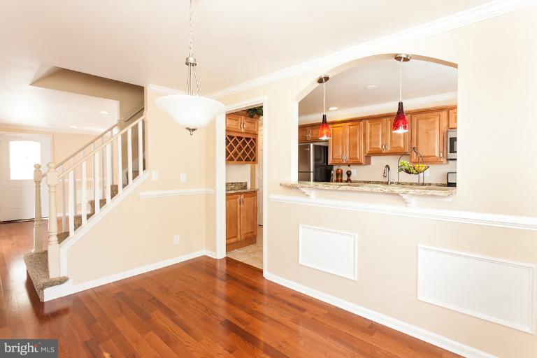5540 Silverbell Road Baltimore, MD 21206 - Photo 25 of 30 a view of a hallway with wooden floor