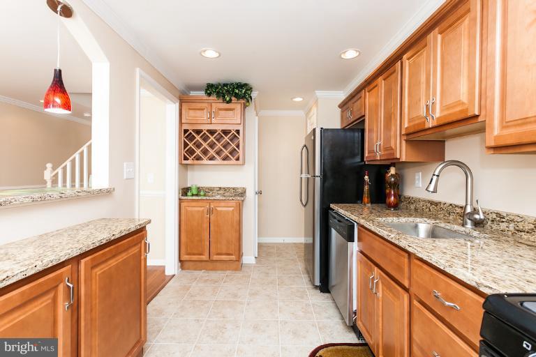 5540 Silverbell Road Baltimore, MD 21206 - Photo 30 of 30 a kitchen with stainless steel appliances granite countertop a refrigerator and a sink
