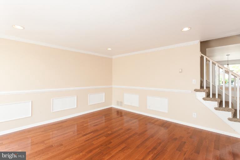 5540 Silverbell Road Baltimore, MD 21206 - Photo 10 of 30 a view of an empty room with wooden floor