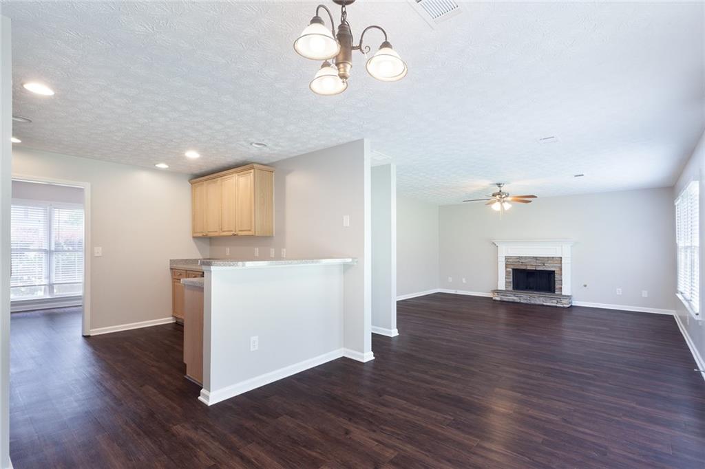 49 Parkside Drive Dallas, GA 30157 - Photo 12 of 31 a view of a kitchen with wooden floor and a ceiling fan