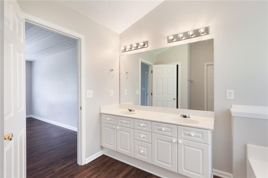 49 Parkside Drive Dallas, GA 30157 - Photo 22 of 31 a bathroom with a double vanity sink and a mirror