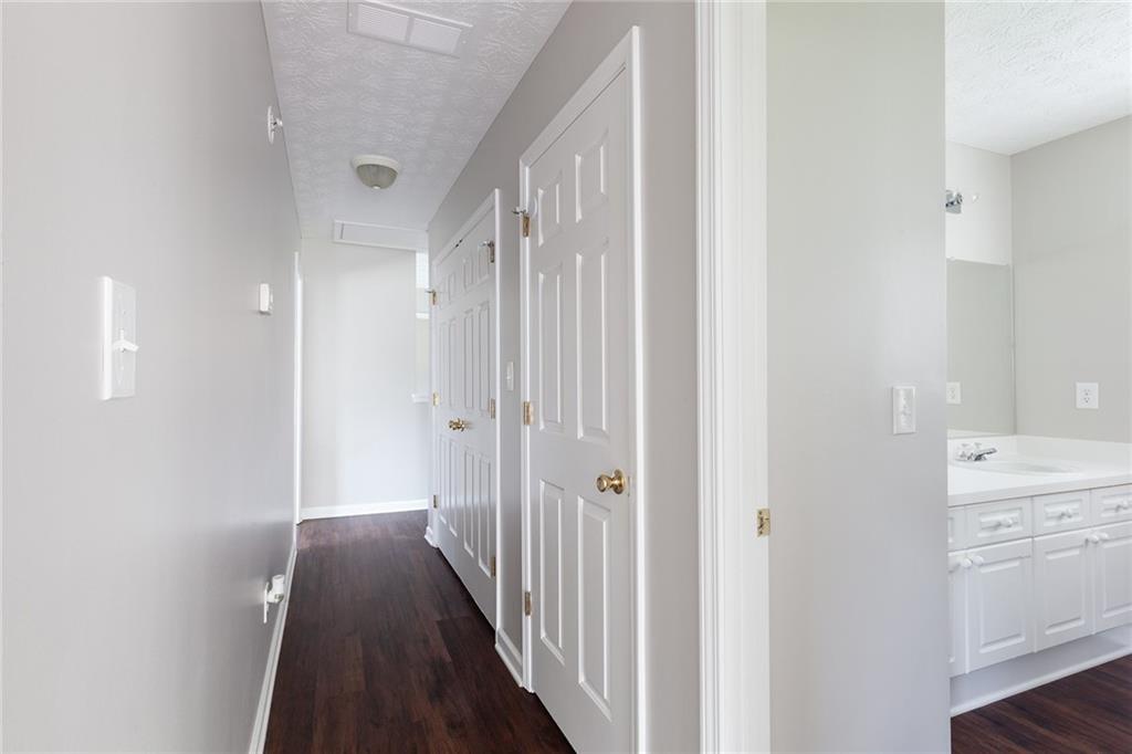 49 Parkside Drive Dallas, GA 30157 - Photo 26 of 31 a view of a hallway with a closet and wooden floor