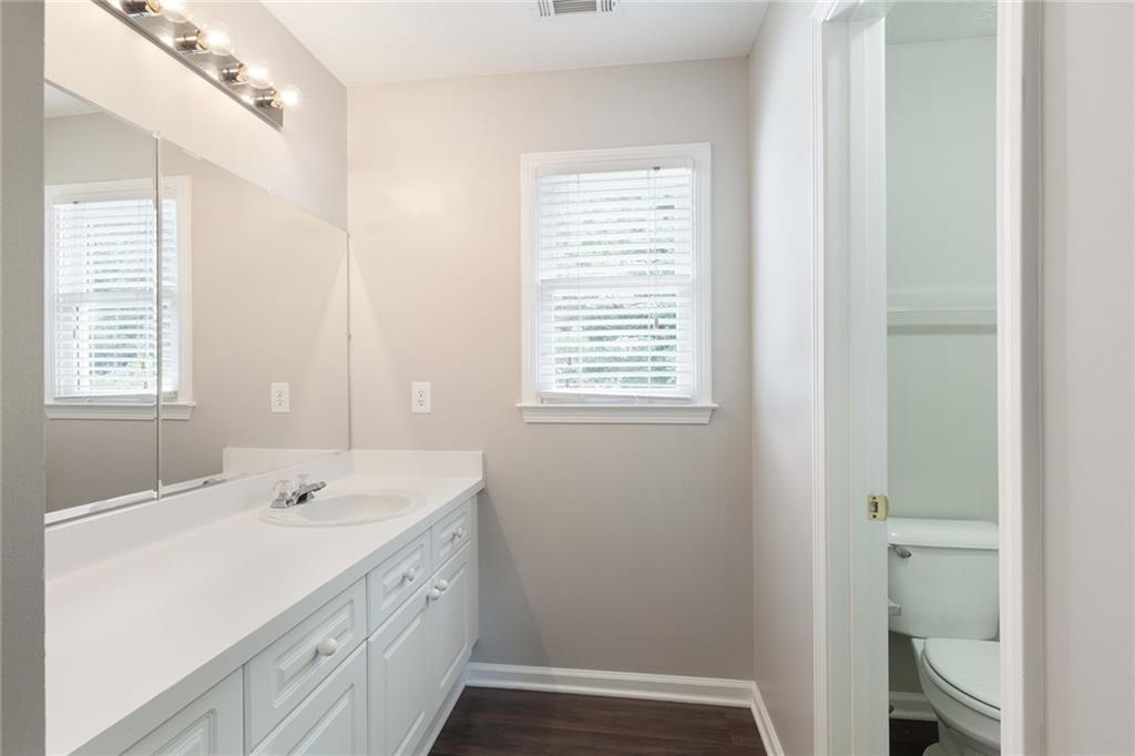49 Parkside Drive Dallas, GA 30157 - Photo 27 of 31 a spacious bathroom with a shower sink and mirror