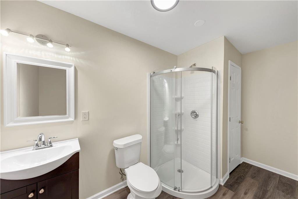 2880 Field Spring Drive Lithonia, GA 30058 - Photo 7 of 31 a bathroom with a toilet sink and shower