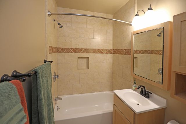 a bathroom with a sink and a shower