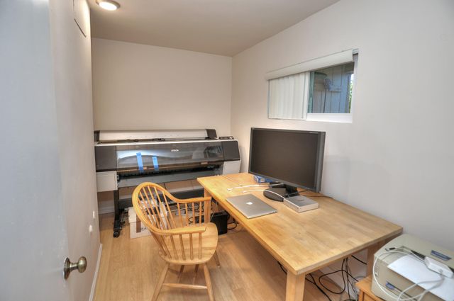 a view of a workspace with furniture