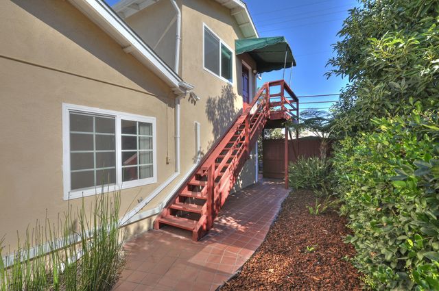 a view of outdoor space with stairs and wooden floor