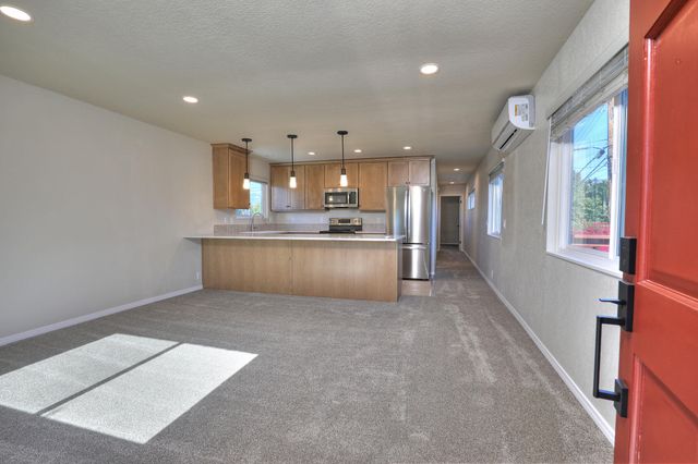 a view of kitchen and windows