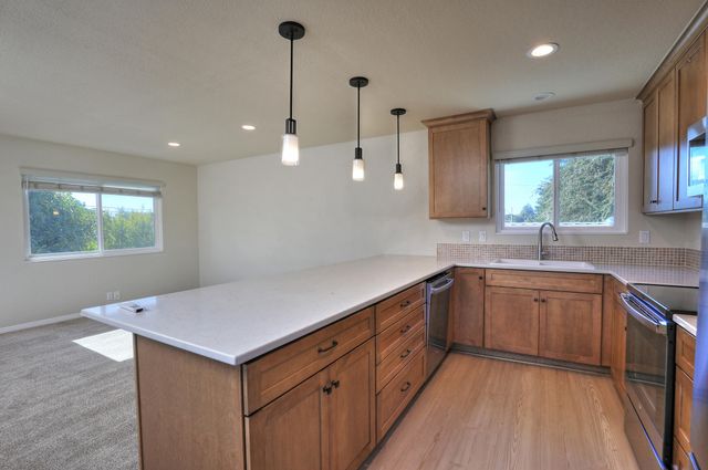 a kitchen with sink and window