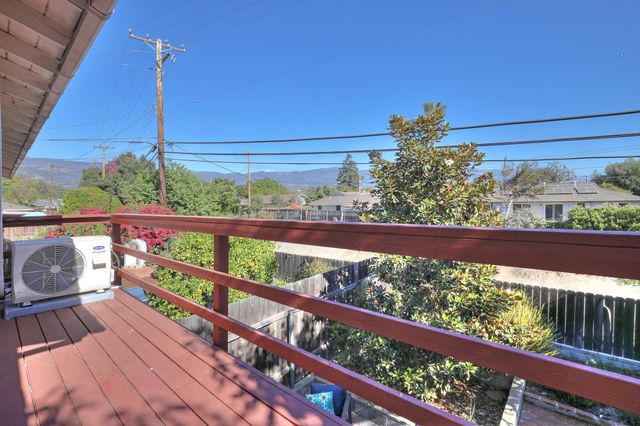 a view of a balcony with wooden floor