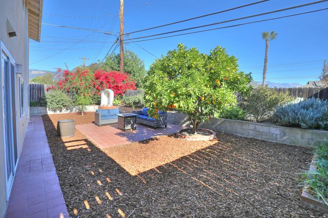 a view of a backyard with sitting area