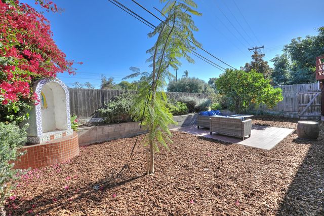 a view of a backyard with sitting area