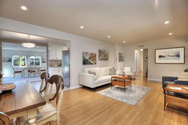 a living room with furniture and a table